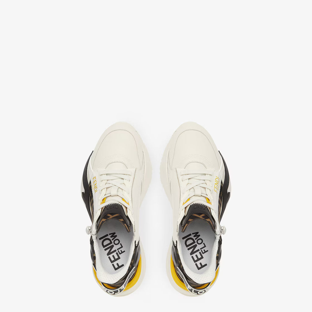 Pair of white Fendi Flow trainers from above, black logo lining, yellow accents