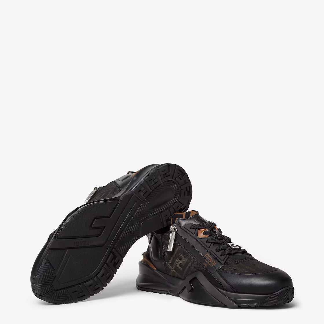 Black low-top sneakers with tread sole, FF pattern upper, and orange trim