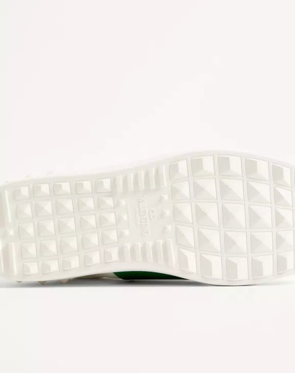White rubber outsole with grid tread pattern for traction.