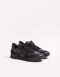 Black camouflage Rockrunner sneaker with lace-up front and low-profile sole.
