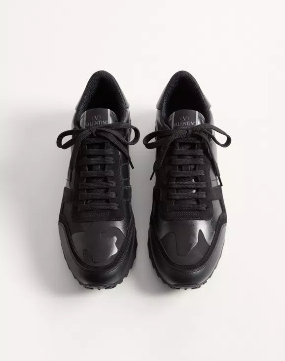 Black lace-up Rockrunner sneakers with Valentino logo on the tongue.