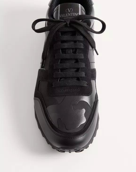 Black Rockrunner sneaker with camouflage accent and Valentino logo on tongue.
