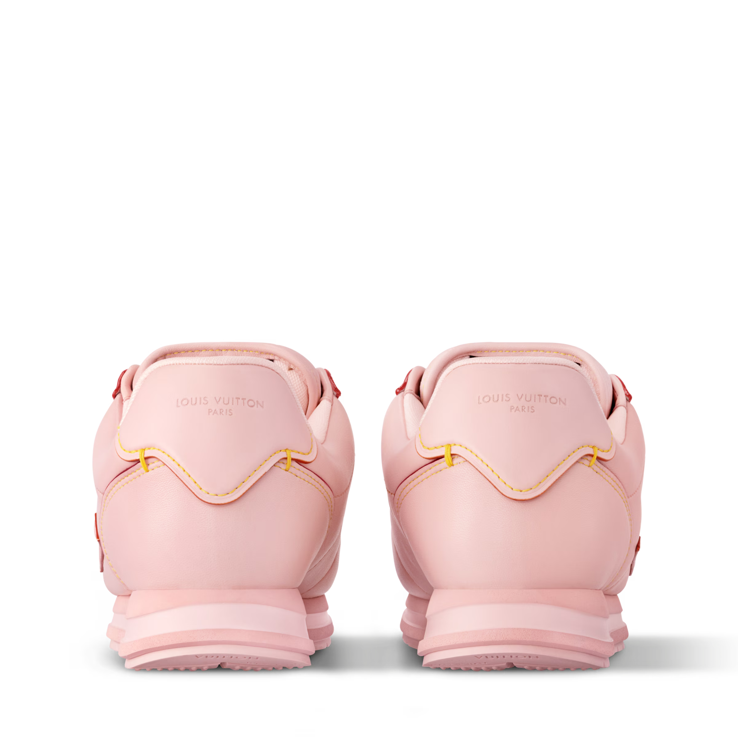 Pink lace-up sneakers, rear view with padded collar and stacked rubber sole