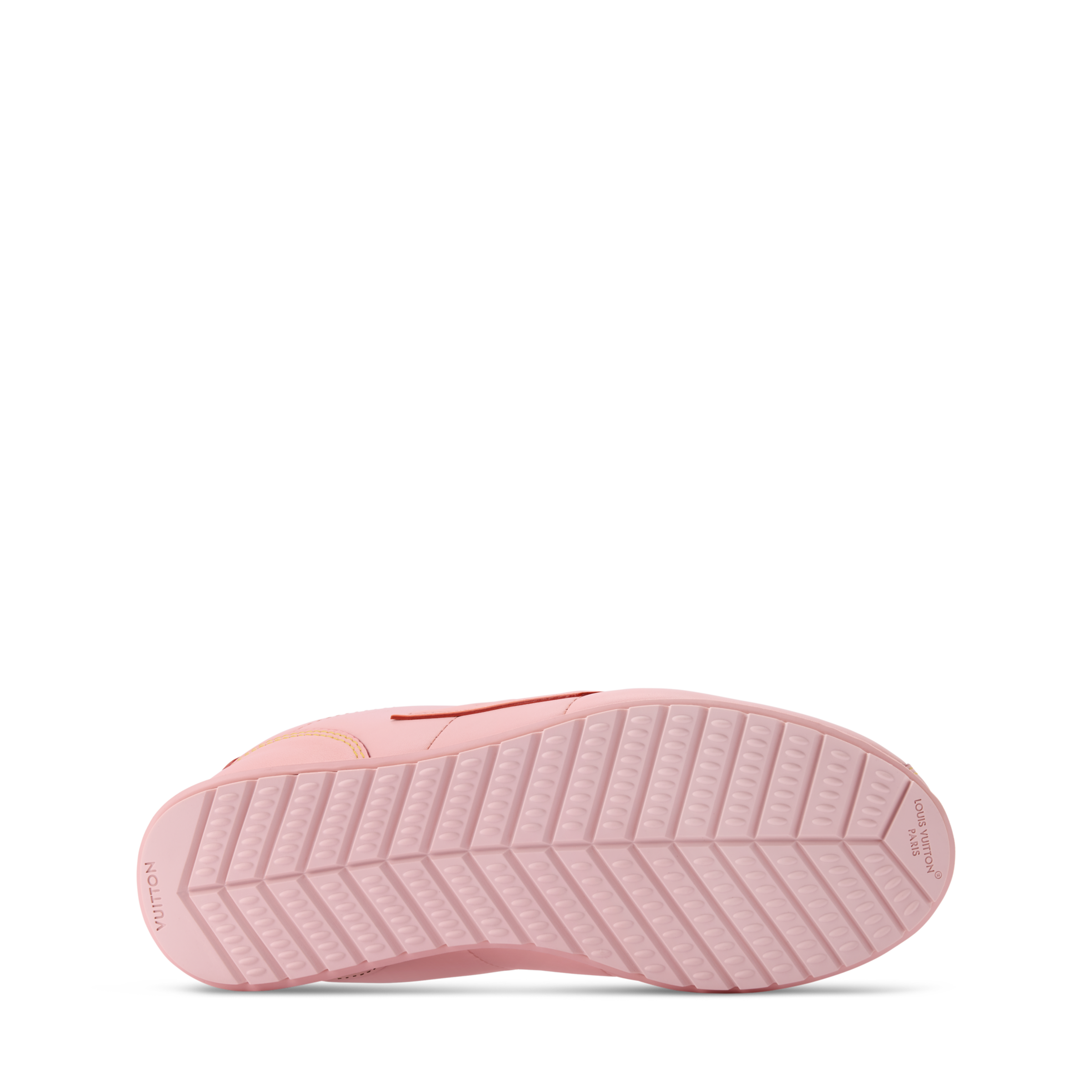 Pink sneaker outsole with textured tread and low-profile rubber platform sole