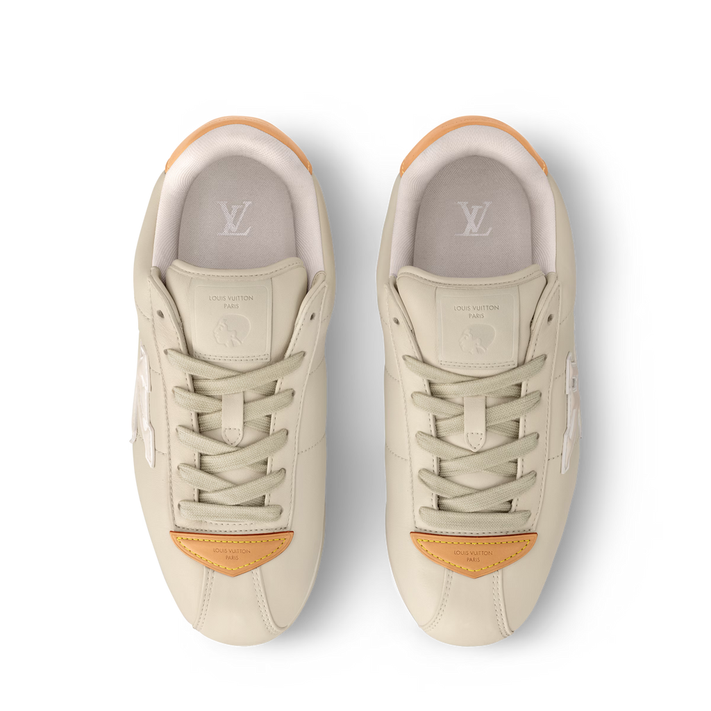 LV BUTTERSOFT sneaker, beige front view with LV insole and orange heel tab detail