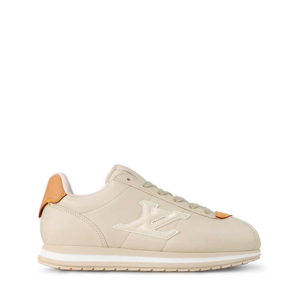 LV BUTTERSOFT sneaker side profile, beige upper with LV logo patch and orange accents
