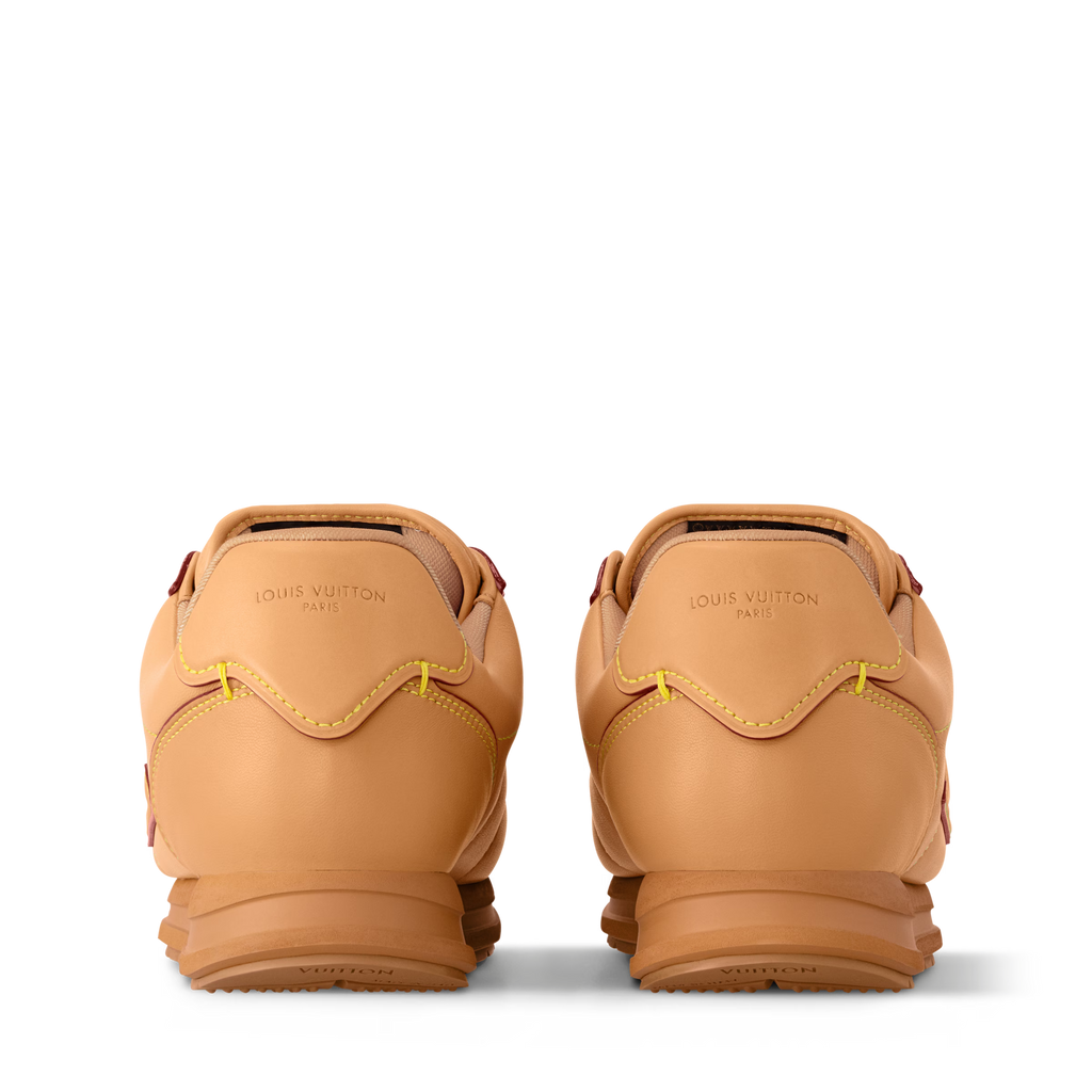 Tan sneaker heel view with Louis Vuitton branding and padded back tabs