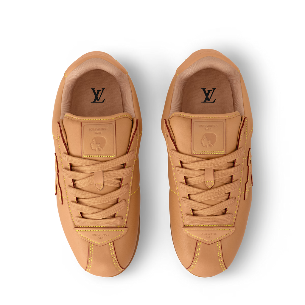 Pair of tan sneakers with LV monogram on tongues and stitched lace panels