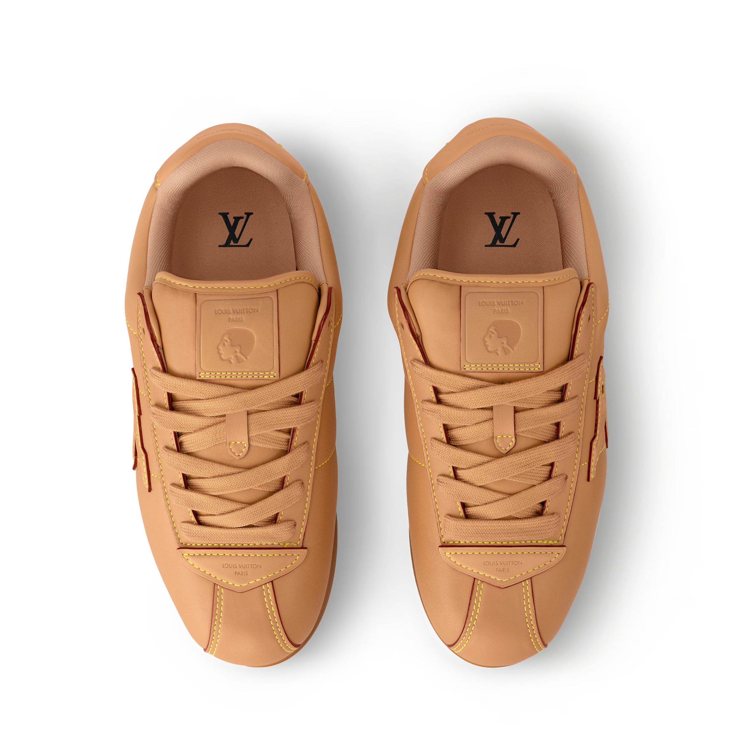 Pair of tan sneakers with LV monogram on tongues and stitched lace panels