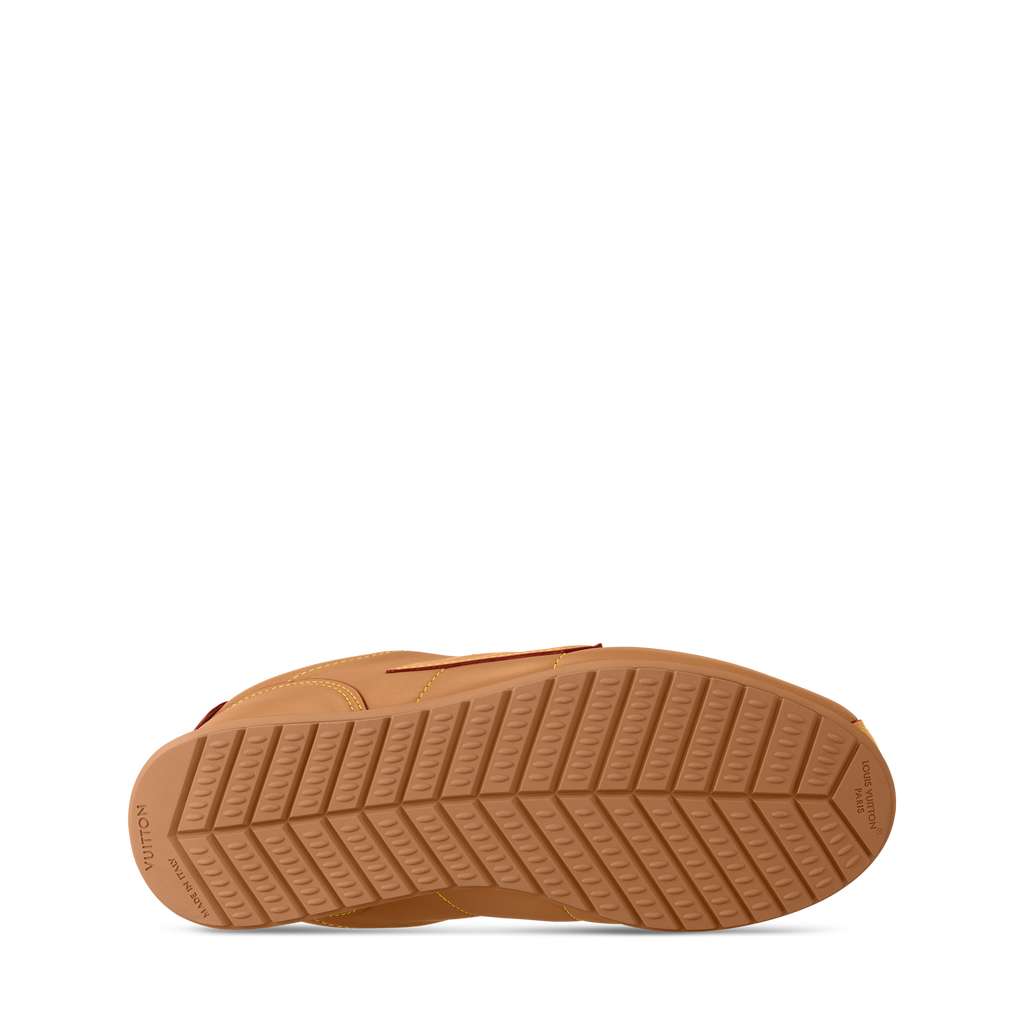 Tan rubber outsole with tread pattern and Louis Vuitton logo markings