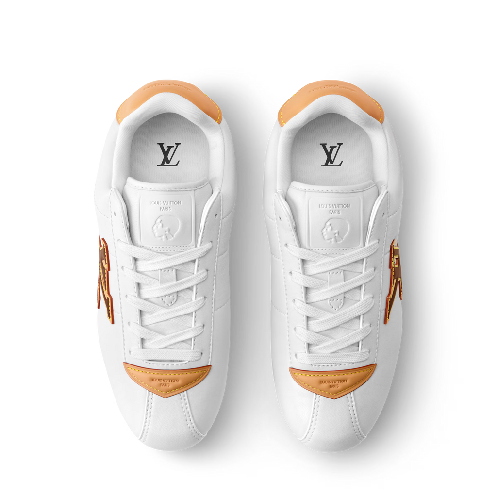 White LV Buttersoft sneakers with orange heel trim and Louis Vuitton logo on insoles