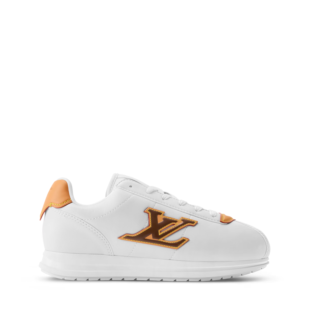 White LV Buttersoft sneaker with large orange-gold LV logo and orange lace accents