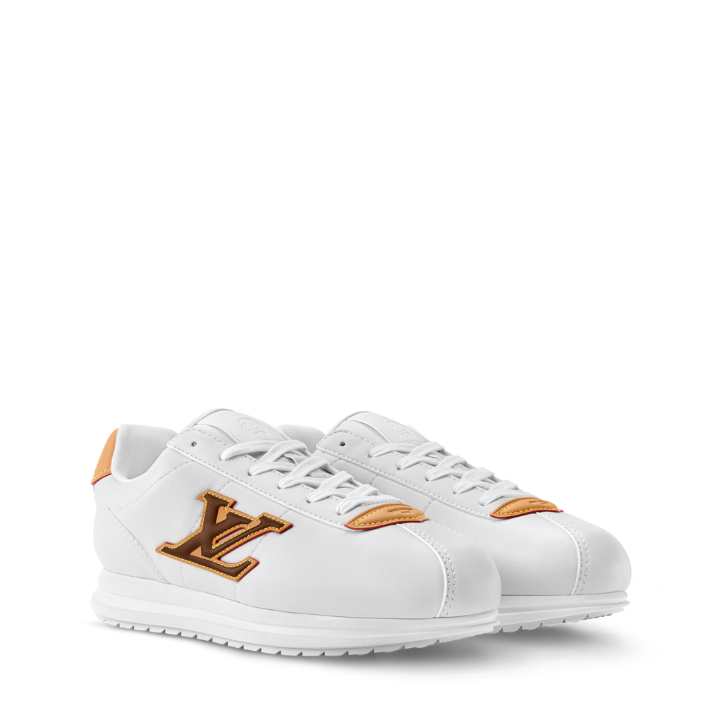 White LV Buttersoft sneakers with orange-gold LV logo patch and white laces