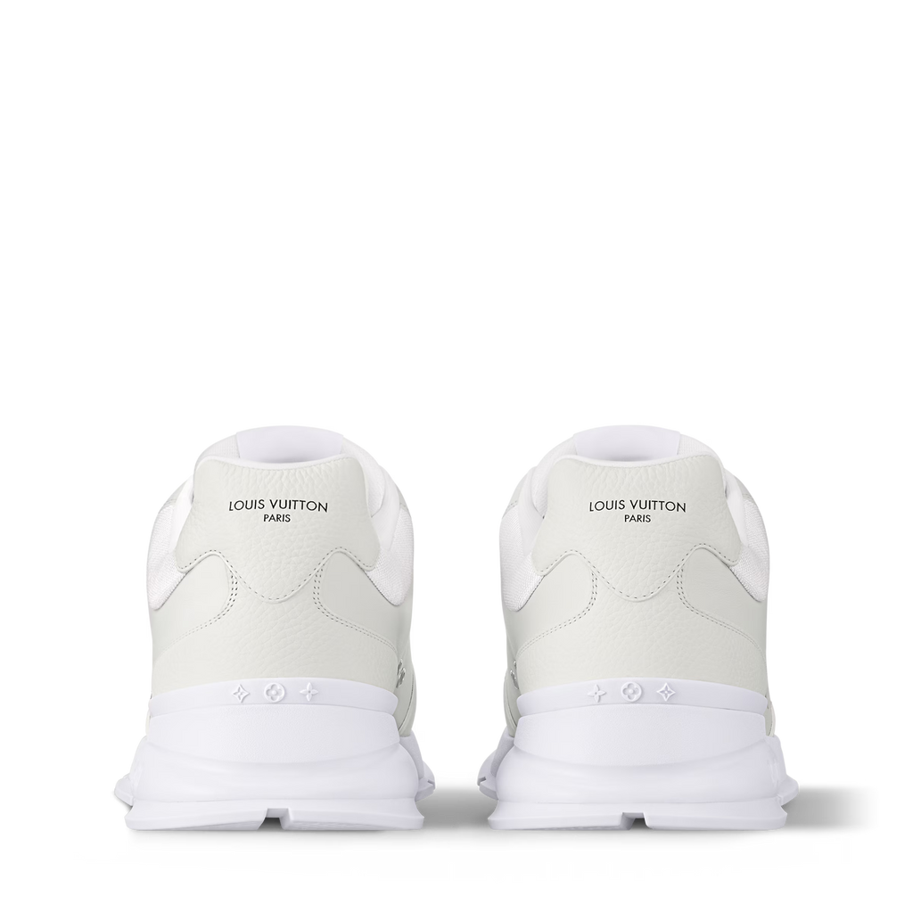 Pair of white trainers showing rear panels with brand text and cushioned heel tabs