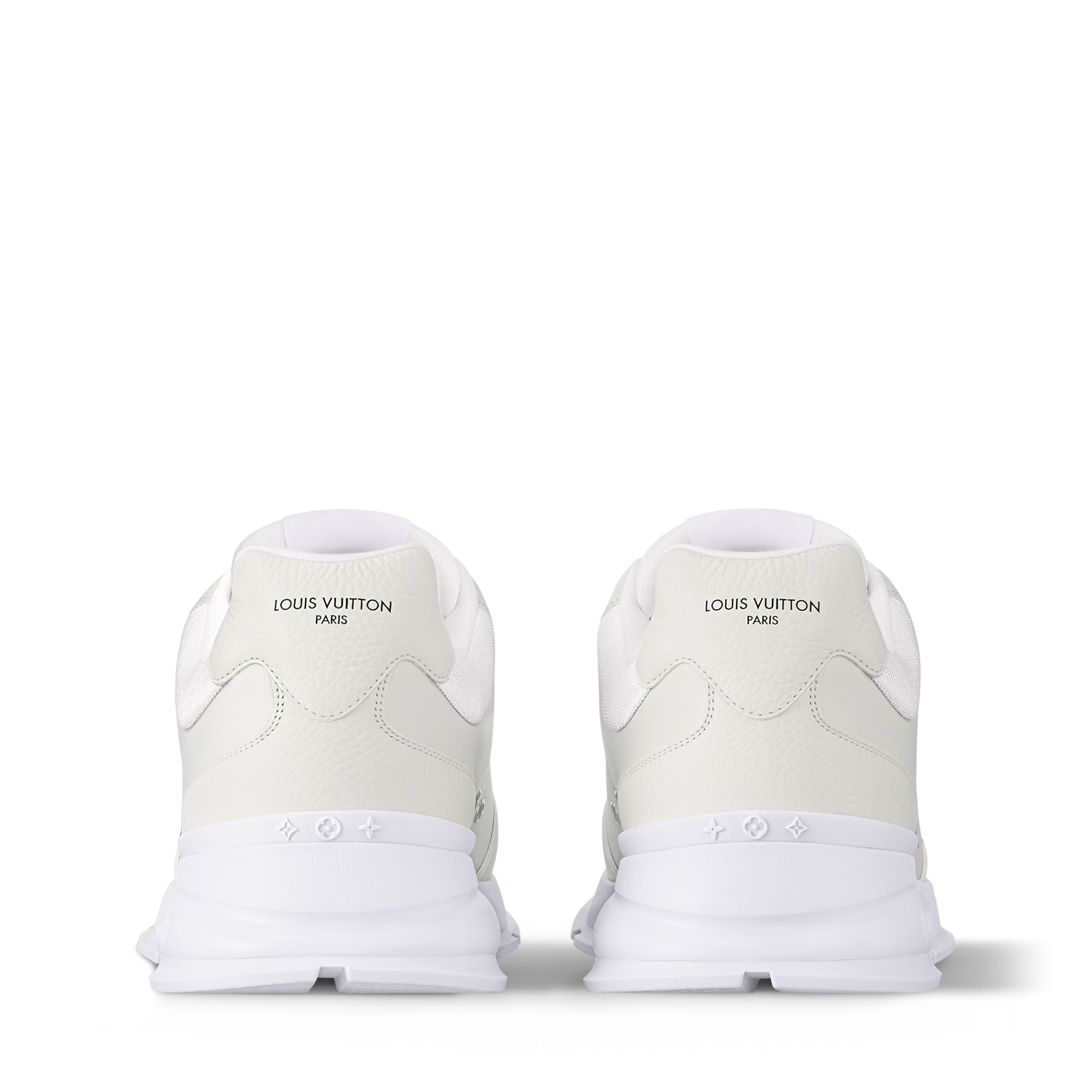 Pair of white trainers showing rear panels with brand text and cushioned heel tabs