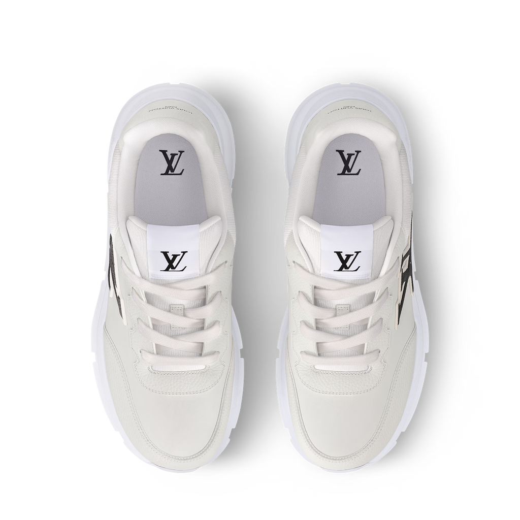 White trainers front view with lace eyelets and LV logo on tongue and interior
