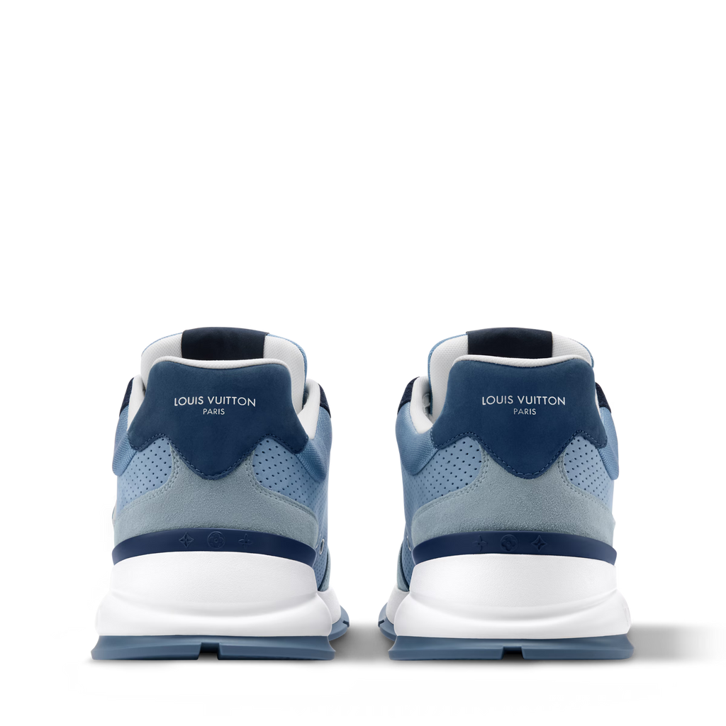 Blue low-top sneakers with rear heel branding and white midsole