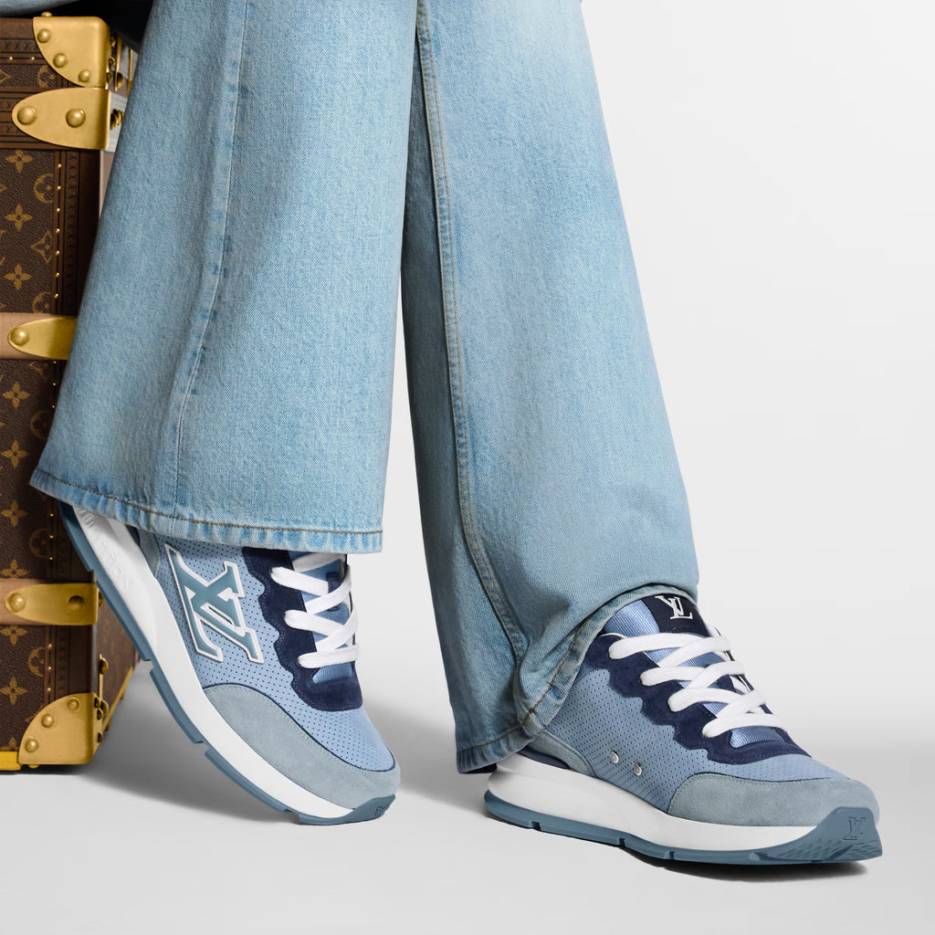 Light blue low-top sneakers with white laces worn with light-wash jeans