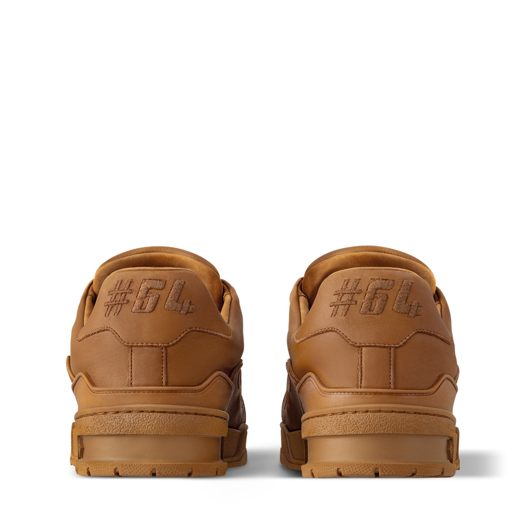 LV Trainer sneaker pair, tan heel view with embossed back branding and lace loops