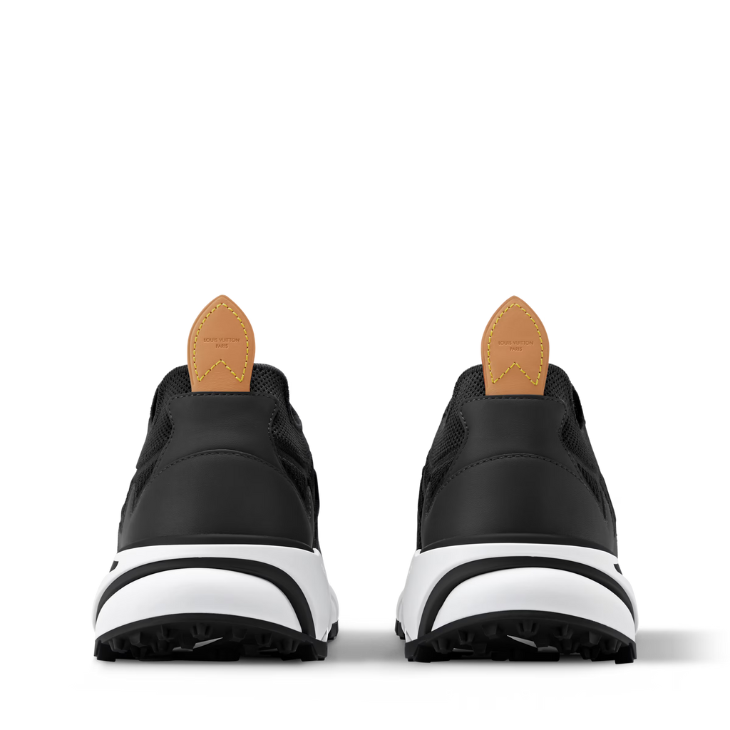 Black high-top trainer with tan heel tab, white midsole, and rear pull-on collar