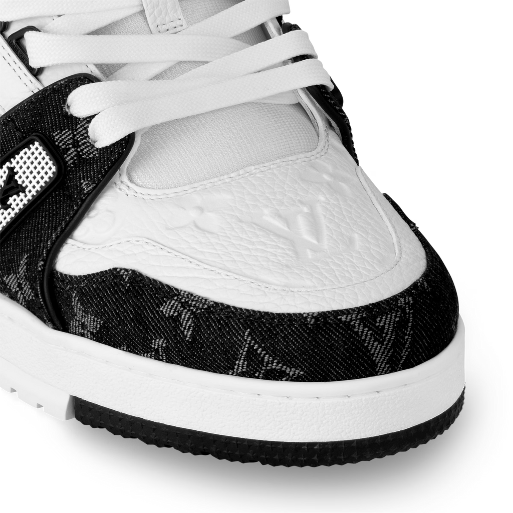 Close-up of white laces and black textured quarter panel on LV trainers