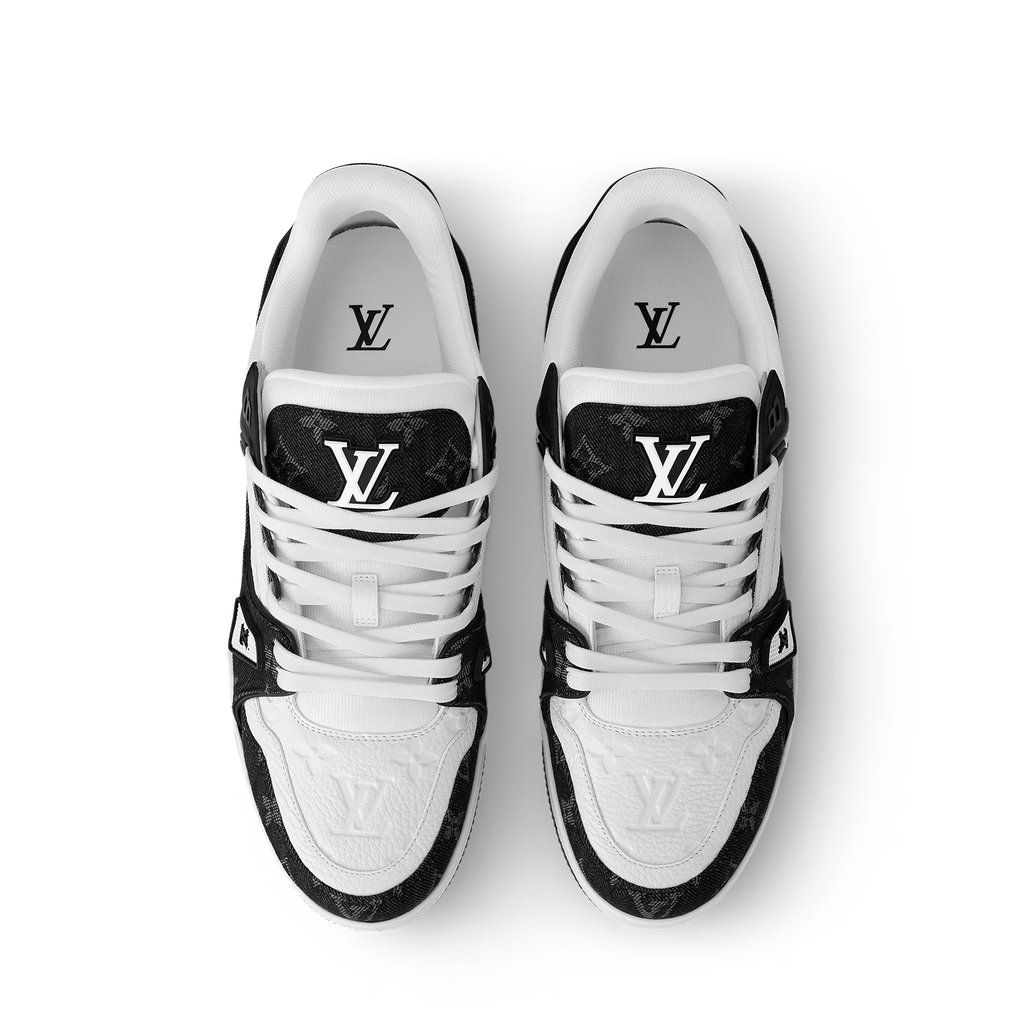 Pair of white and black LV trainers, top view with LV emblem on tongue and sides