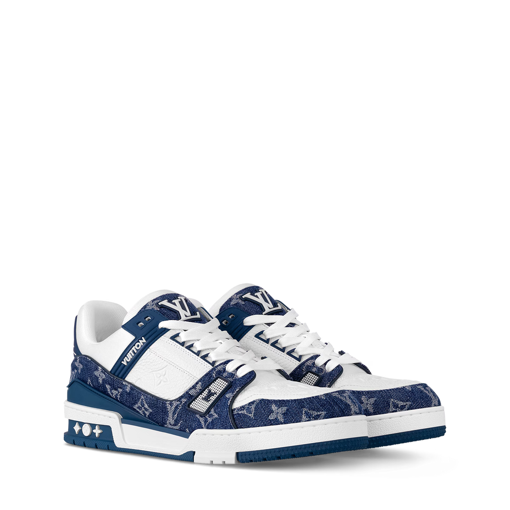LV trainers with white leather panels, navy monogram canvas, and blue rubber sole.