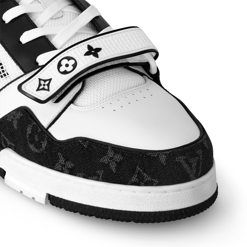 LV Trainer sneakers front quarter close-up, black and white panels with laces