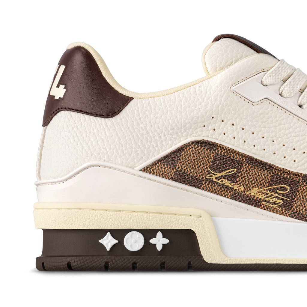 Cream leather heel of brown-accent LV sneakers with star tab and chunky sole.