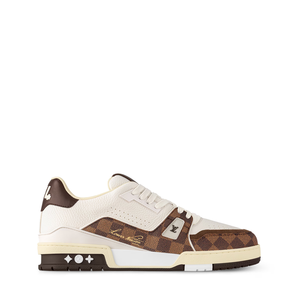 Side view of cream and brown LV sneakers with white laces and chunky sole.