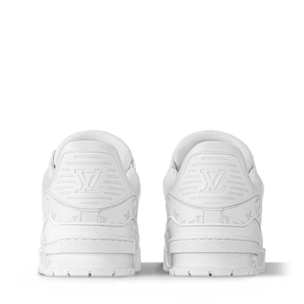 LV Trainer distressed white sneaker heel view, lace-up with monogram embossing