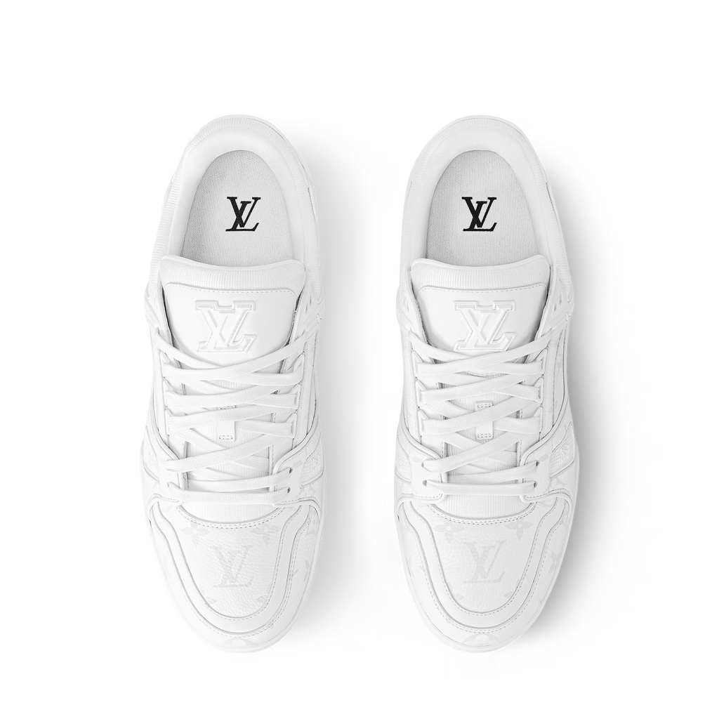 LV Trainer distressed white sneaker top view, padded tongue with LV logo