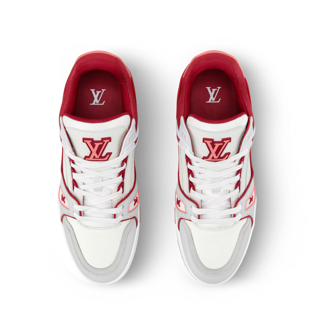 Front view of white and red LV low-top sneakers with red logo on tongue