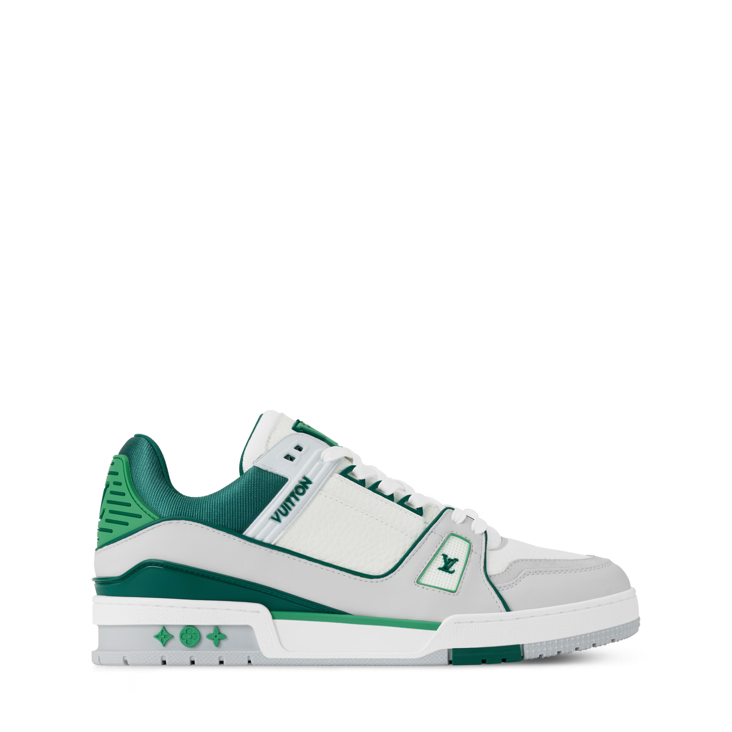 Side profile of white and green low-top sneakers with green accent outsole