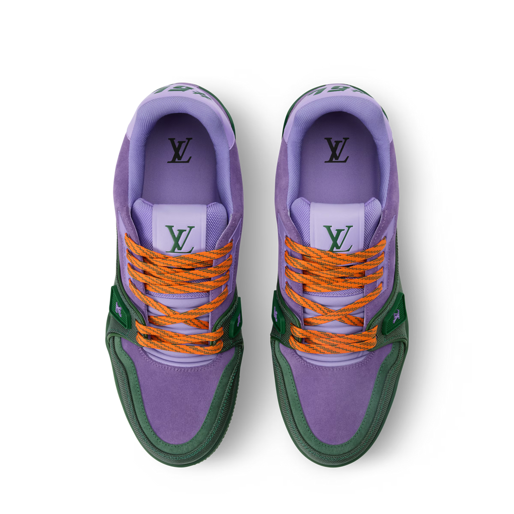 Pair of purple LV Trainer sneakers with orange laces and LV tongue logo