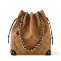 Monogram canvas drawstring bucket bag with black leather trim and gold chain handles